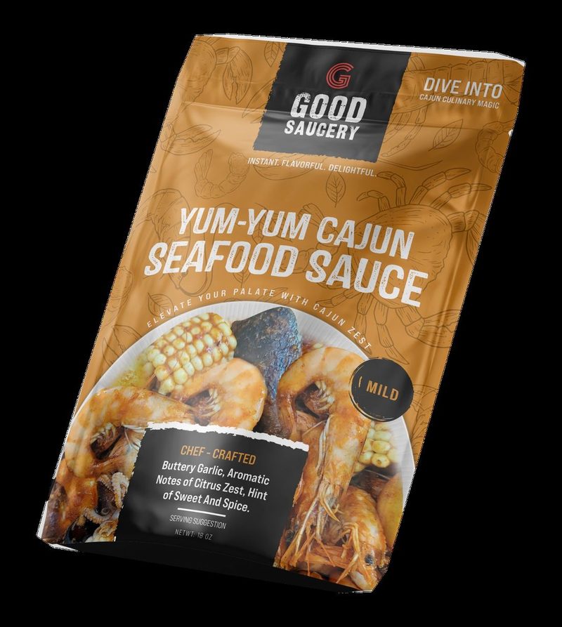 Full front of the gold Yum-Yum Cajun Seafood Sauce Mild pouch